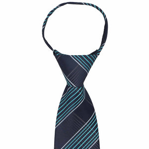 The knot and collar on a navy blue and turquoise plaid zipper tie
