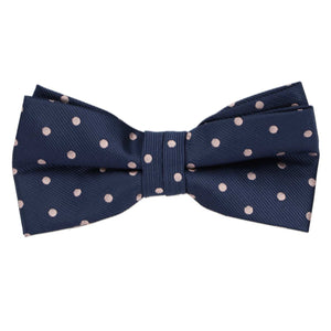 A pre-tied navy blue and blush pink bow tie