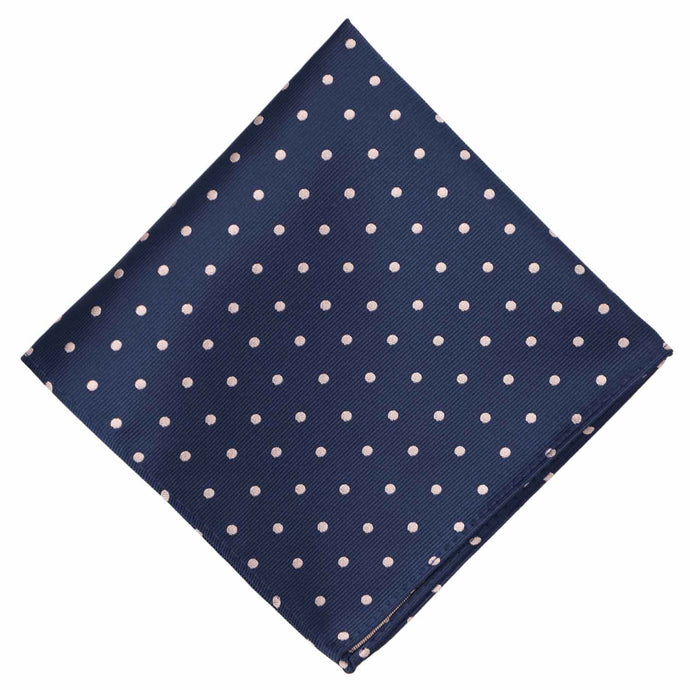 A navy blue and blush polka dot pocket square