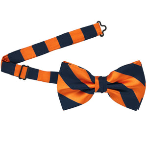 A navy blue and orange pre-tied bow tie with the band collar open
