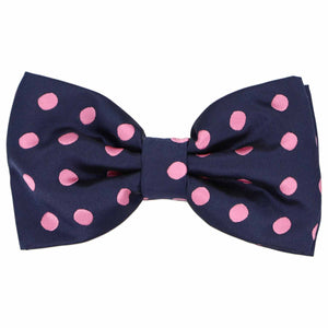 This men's navy blue pre-tied bow tie features fun pink polka dots