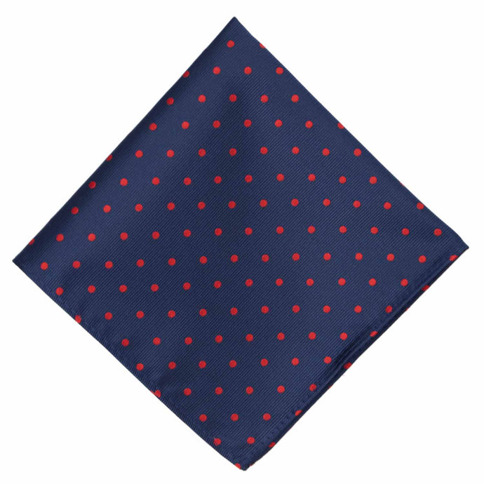 A navy blue and red polka dot pocket square