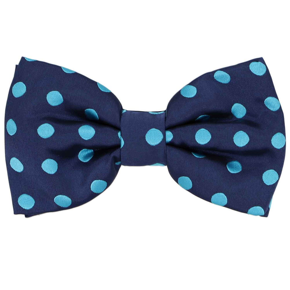 A fun navy blue pre-tied bow tie with a turquoise polka dot pattern