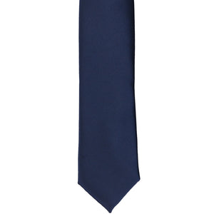 The front of a navy blue skinny tie