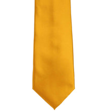 Load image into Gallery viewer, The front of a solid nugget gold color necktie, laid flat