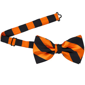 An orange and black striped bow tie with the band open