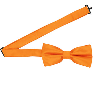 An orange pre-tied bow tie with the band open