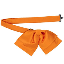 Load image into Gallery viewer, Bright orange pre-tied floppy bow tie with an adjustable neck strap and black buckle, displayed on a clean white background.