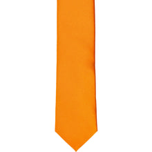 Load image into Gallery viewer, The front of an orange skinny tie, laid flat
