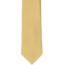Load image into Gallery viewer, The front of a pale gold herringbone tie, laid out flat