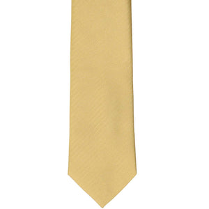 The front of a pale gold herringbone tie, laid out flat