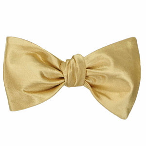 Solid pale gold self-tie bow tie, tied