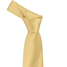 Load image into Gallery viewer, Tied knot on a pale gold necktie