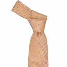 Load image into Gallery viewer, Orange geometric patterned tie, knotted, on a white background