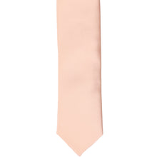 Load image into Gallery viewer, The front of a petal pink skinny tie, laid flat