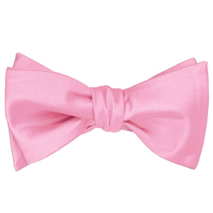 Solid pink self-tie bow tie, tied
