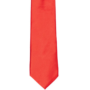 The front of a slim solid tie, laid out flat