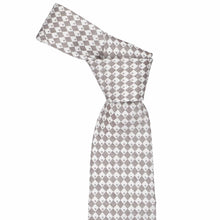 Load image into Gallery viewer, Knotted necktie with a geometric pattern on a white background