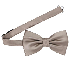 A portobello pre-tied bow tie with the band collar open
