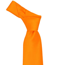Load image into Gallery viewer, Orange knotted necktie on a white background