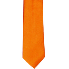 Load image into Gallery viewer, The front of a pumpkin orange solid tie, laid out flat