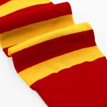 Load image into Gallery viewer, A close-up of a striped knit sock, with alternating wide red and golden yellow horizontal bands on a white background.