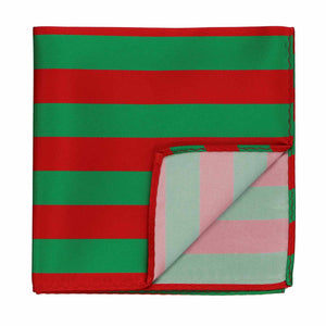A red and green striped pocket square with the corner flipped up to show the backside