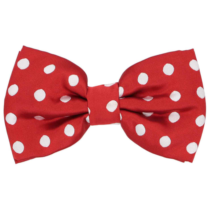 A red pre-tied bow tie with a white polka dot pattern