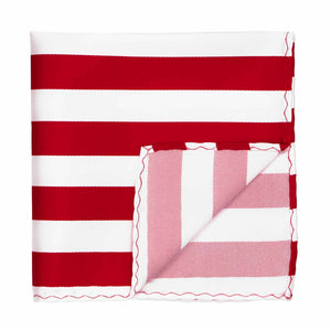 A red and white striped pocket square with the corner flipped up to show the inside