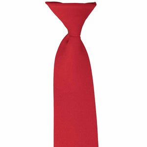 The front top knot on a red clip-on uniform tie