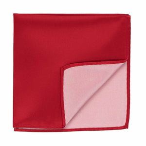 A red pocket square with the corner flipped up to show the inside
