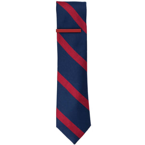 A red tie bar on a red and navy blue striped skinny tie