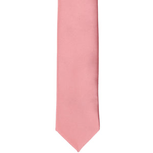 The front of a rose petal pink skinny tie, laid out flat
