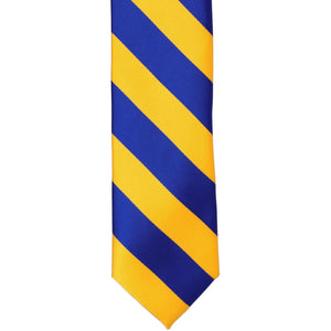 The front of a royal blue and golden yellow striped tie, laid out flat