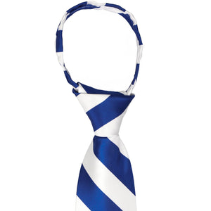 The knot on a royal blue and white zipper tie