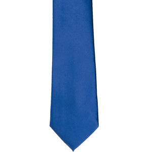 The front of a royal blue slim tie, laid out flat