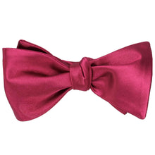 Load image into Gallery viewer, A ruby red self-tie bow tie, tied