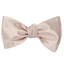 Load image into Gallery viewer, A solid color sand pink self-tie bow tie, tied