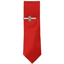 Load image into Gallery viewer, A solid red tie with a silver tie bar featuring Santa in a chimney
