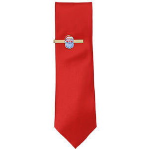 A Santa face gold tie bar on a red necktie