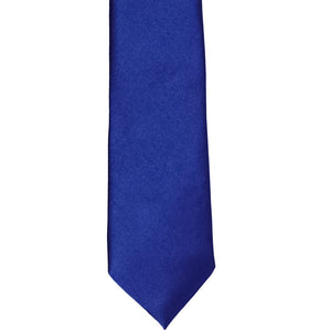 The front of a sapphire blue slim tie, laid out flat
