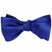 Load image into Gallery viewer, A sapphire blue self-tie bow tie, tied