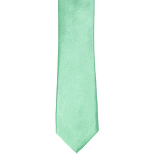 The front of a seafoam skinny tie, laid flat