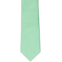 Load image into Gallery viewer, The front of a seafoam slim tie, laid out flat