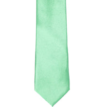 Load image into Gallery viewer, The front of a seafoam solid tie, laid out flat