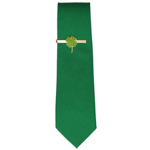 Load image into Gallery viewer, A solid green tie with a gold and green shamrock tie bar