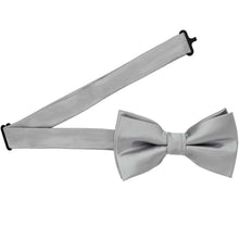 Load image into Gallery viewer, A pre-tied silver bow tie with the band collar open