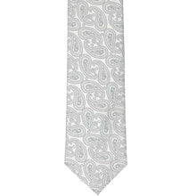 Load image into Gallery viewer, The front of a silver paisley slim tie, laid flat