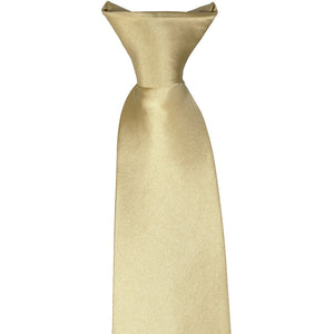 The knot on the front of a sparkling champagne clip-on tie, laid flat