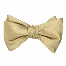 Load image into Gallery viewer, A solid color sparkling champagne self-tie bow tie, tied
